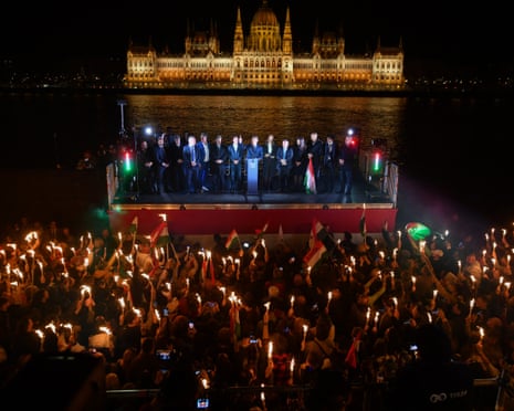 Peter Magyar, leader of the pro-European conservative TISZA party, addresses supporters on the banks on the river Danube with the Parliament building in the background in Budapest, Hungary