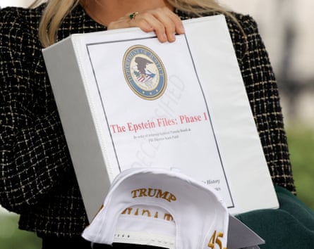 Woman holds white binder