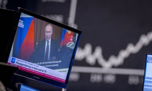 Vladimir Putin appears on a television screen at the stock market in Frankfurt, Germany, Feb. 25, 2022. Russia is revving up its sophisticated propaganda machine as its military advances in neighbouring Ukraine. Analysts who monitor propaganda and disinformation say they've seen a sharp increase in online activity linked to the Russian state in recent weeks. Photo by: AP Photo/ Michael Probst