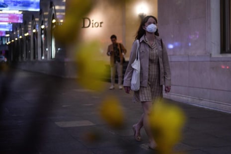 A woman wearing a protective face mask walks on a street in Hanoi. Vietnamese authorities have declared all 16 of the country’s coronavirus cases cured