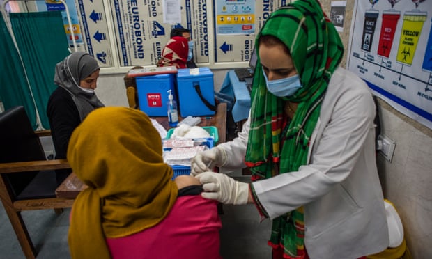 A nurse injects a dose of the Indian-made version of the Oxford/AstraZeneca vaccine in Srinagar, Kashmir.