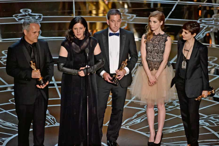 The Citizenfour team accept the award for best documentary feature.