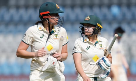 Tahlia McGrath and Alyssa Healy walk from the field at tea on day three of the women's Test between India and Australia.