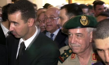 Bashar al-Assad, left, and Mustafa Tlass, right in beret, in 2000.