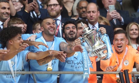 Manchester City with the FA Cup trophy after their victory in last year’s final