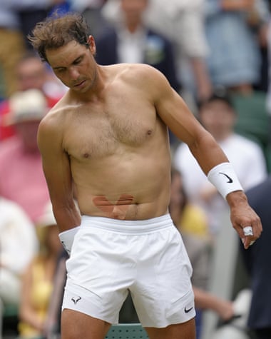 Rafael Nadal with tape on his stomach after a medical timeout during his quarter-final against Taylor Fritz