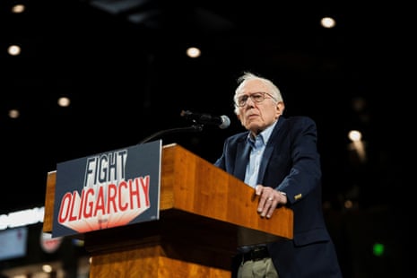 a man looks out from behind a lectern that reads 'fight oligarchy'