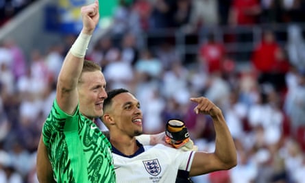 Jordan Pickford celebrates with Trent Alexander-Arnold after their win against Switzerland