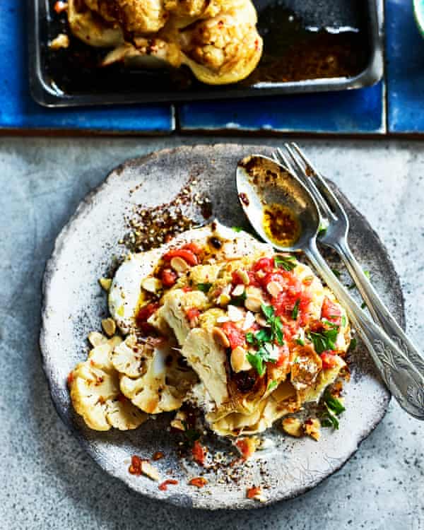Cauliflower steak with labneh and grated tomatoes.