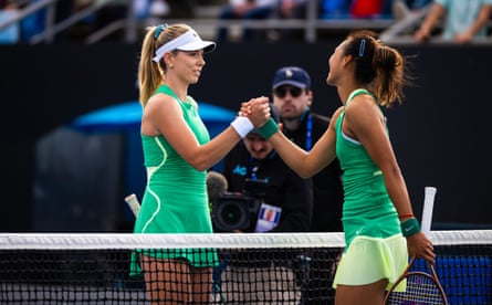 Katie Boulter shakes hands with Zheng Qinwen after their match.