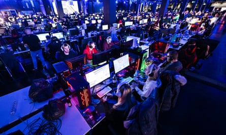 Gamers play video games during the Gamescom LAN event