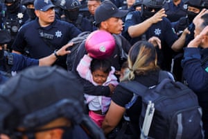 Ciudad Juárez, Mexico. Police evict families, mostly from Venezuela, from a camp in front of a migration detention centre where several people died during a fire in March