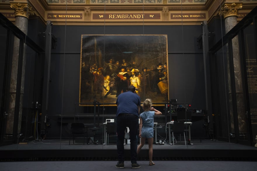 Visitors take in The Night Watch at the Rijksmuseum in Amsterdam in June.