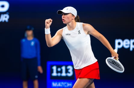 Iga Świątek pumps her fist after wining a point