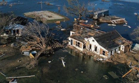 Flood waters brought by Hurricane Delta surround structures already destroyed by Hurricane Laura in Creole, Louisiana.