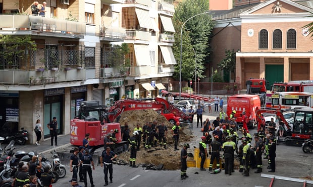 Rescue workers at the scene in Via Innocenzo XI