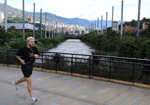 A man jogs along the Parques del Rio in Medellín