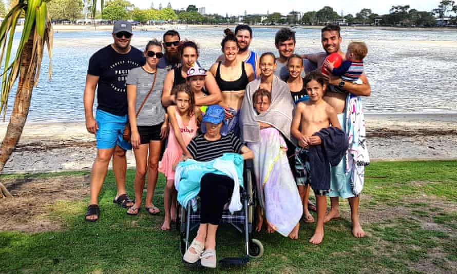 Lech Blaine’s mother with the family photo at Currumbin Beach