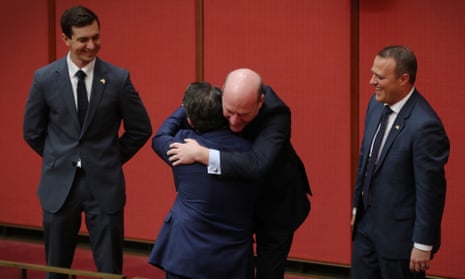 Trevor Evans and Tim Wilson look on as Trent Zimmerman congratulates Dean Smith during the first reading of his marriage equality bill in the Senate in 2017