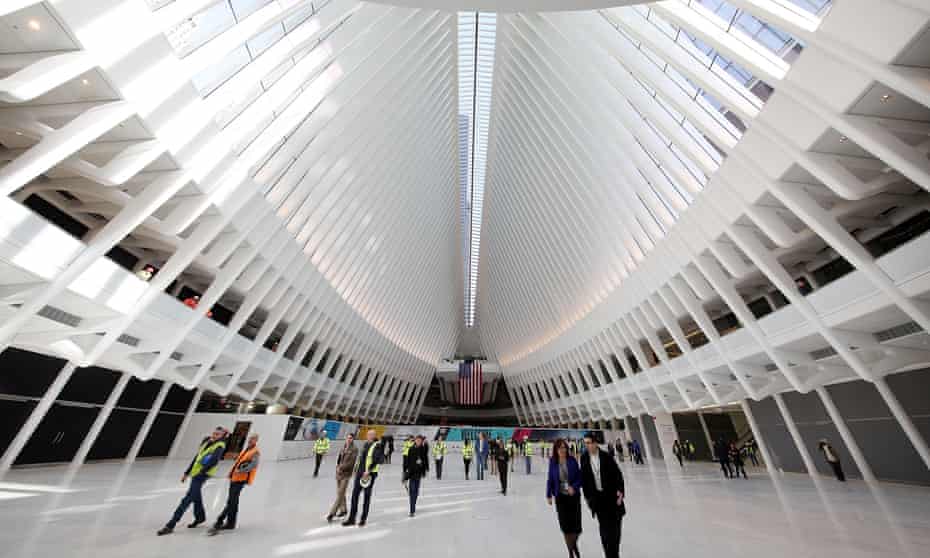People walk through the Oculus concourse of the World Trade Center transportation hub after nearly 12 years of construction.
