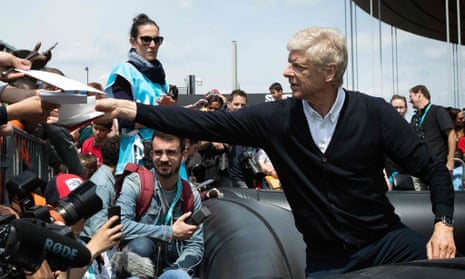 Arsène Wenger signs autographs for fans in Paris this week.