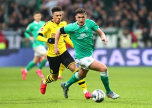 Werder Bremen’s Milos Veljkovic surges past Jadon Sancho of Borussia Dortmund at the Weserstadion in February 2020.