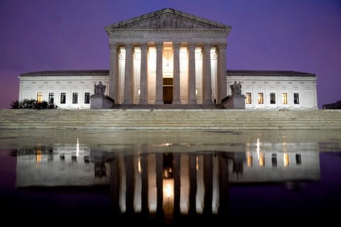 a building is reflected in water