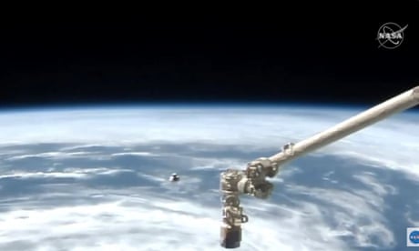 SpaceX Dragon capsule docks with the International Space Station