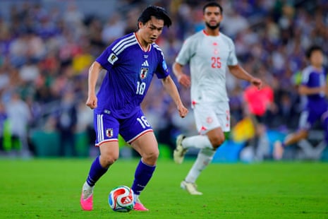 Ayase Ueda of Japan controls the ball.