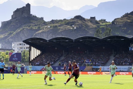 Lucia Di Guglielmo (left) and Hannah Eurlings battle for possession during the Euro 2025 match between Italy and Belgium.