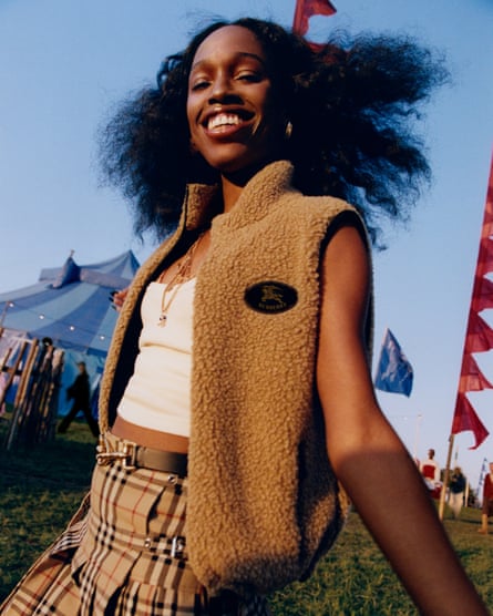A woman in Burberry clothes at a festival
