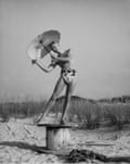 black and white photo of man on beach