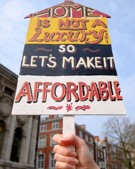A placard reading 'Home is not a Luxury so let's make it affordable'.