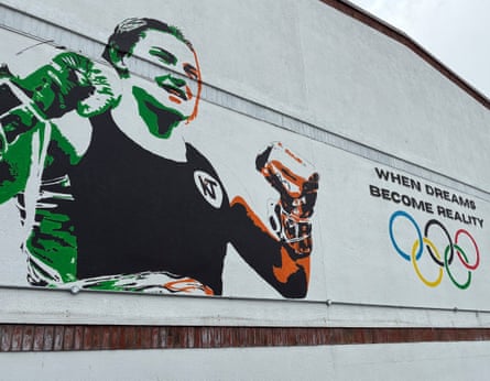 A mural of Katie Taylor with the Olympic rings and the words ‘when dreams become reality’ next to her