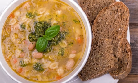 A bowl of minestrone soup with wholegrain bread