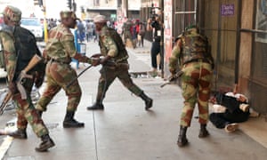 Soldiers beat a protester outside the Movement for Democratic Change party headquarters in Harare.