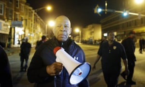Elijah Cummings encourages protesters to comply with a 10pm curfew after unrest over the death of Freddie Gray in Baltimore, Maryland, on 29 April 2015.