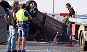 Police check a car involved in the attack in Cambrils.