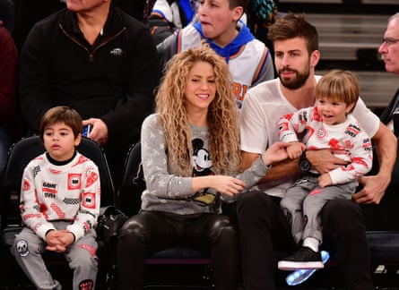 Keeping the balance … Shakira and Gerard Piqué, with their sons Milan, left, and Sasha at a New York basketball game in 2017.
