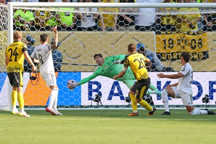 Thibaut Courtois denies Borussia Dortmund's Marcel Sabitzer an equaliser from the last shot of the game.