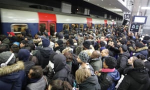 Commuters wait on a platform at the Gare du Nord RER station on Tuesday morning