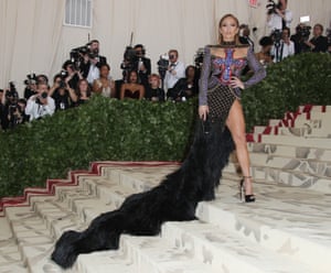 What are the steps of the Met for if not to facilitate a dramatic train? Jennifer Lopez got the memo and turned to Balmain's Olivier Rousteing to design her heavily embellished corset gown, featuring her favourite thigh-revealing slit