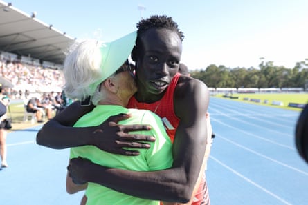 Gout Gout hugs his coach Di Sheppard.