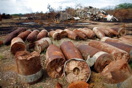 Lines of rusty shells on scrubby ground