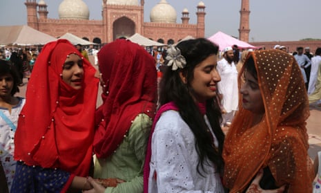 Women in Lahore greet each others after the Eid al-Fitr prayers that mark the end of Ramadan.
