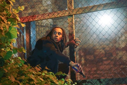 Sekou Diarby climbing a chainlink fence