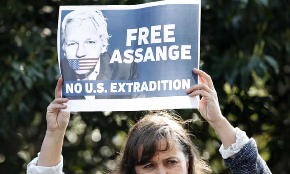 Spanish MEP Ana Miranda holds up a placard in support of Julian Assange outside Belmarsh prison.