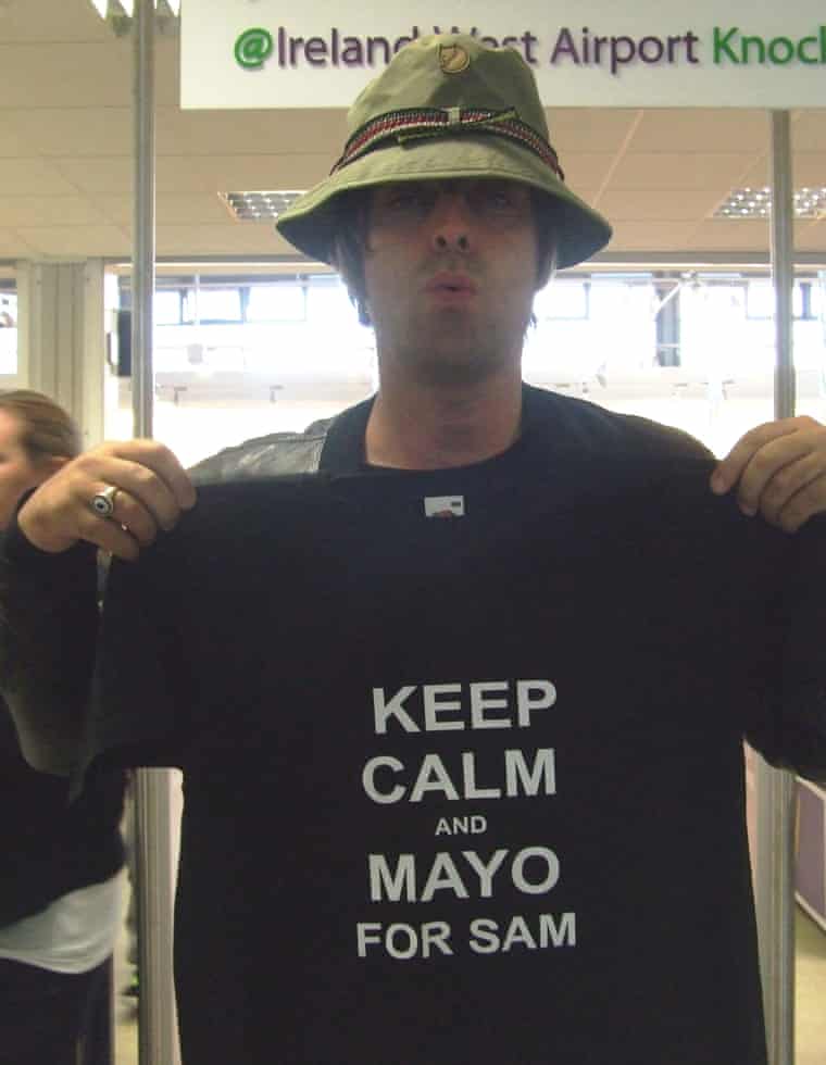 Liam Gallagher holds up a T-shirt supporting County Mayo’s Gaelic football team