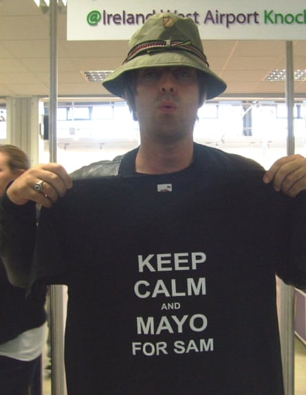 Liam Gallagher holds up a T-shirt supporting County Mayo’s Gaelic football team