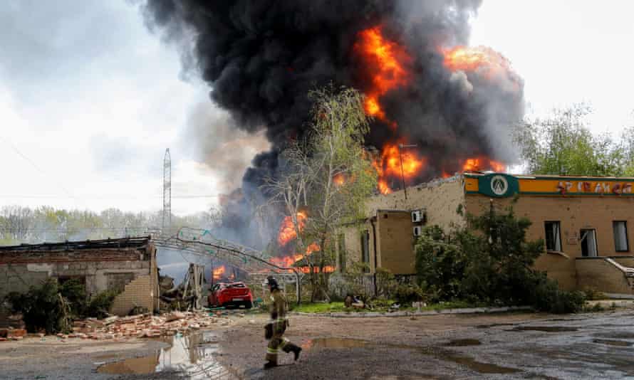 Smoke rises above a burning oil storage in the course of Ukraine-Russia conflict on the outskirts of Donetsk.